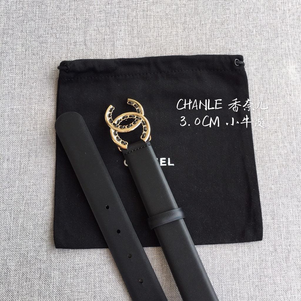 Black belt with gold CC buckle, pouch bag behind the strap