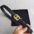 Chanel belt in dark leather with gold square logo buckle and rhinestone details, with holes.