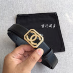 Dark leather Chanel belt with gold square logo buckle, rhinestones, and punched adjustment holes.