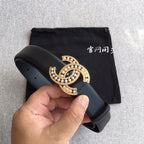 Dark blue leather belt with gold rhinestone CC buckle and punched holes