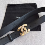 Dark blue leather belt with gold rhinestone CC buckle on a smooth strap