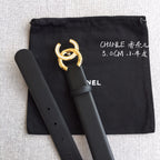 Chanel belt with dark gray strap and gold rhinestone CC buckle