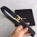 Chanel belt with dark gray strap and gold rhinestone CC buckle