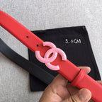 Red belt strap with pink CC buckle and multiple adjustment holes