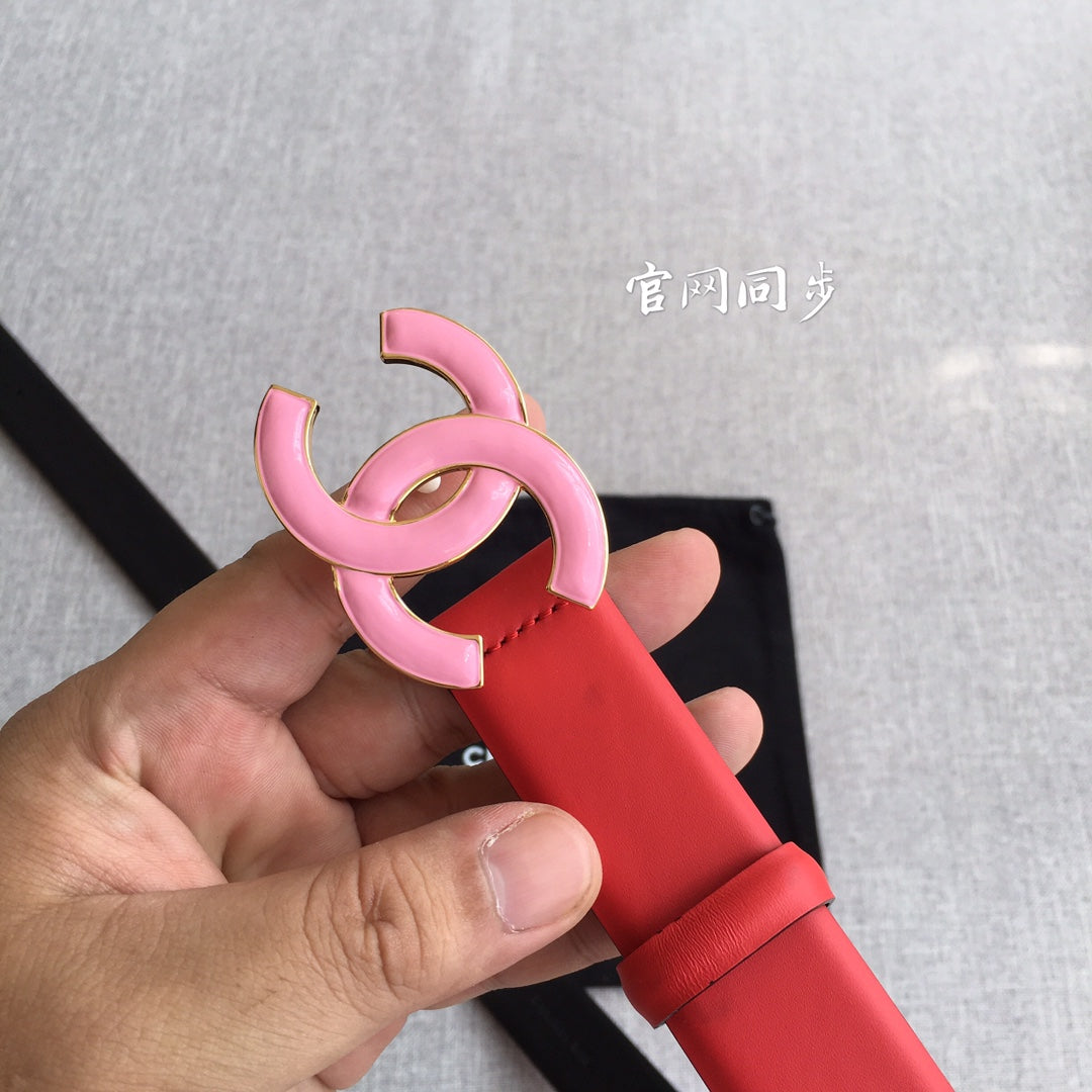 Red belt with pink CC buckle, close-up of buckle and keeper