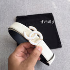 Chanel belt with ivory strap and gold-tone interlocking CC buckle, angled view