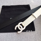Chanel belt with ivory strap and gold-tone interlocking CC buckle, dark embossed text
