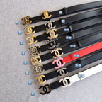 Assorted logo belt straps with gold and silver hardware in black and white.