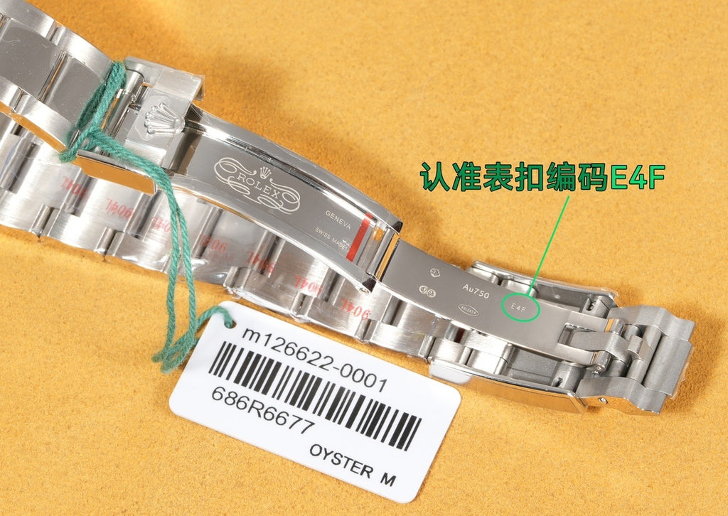 Rolex stainless steel bracelet close-up with clasp and serial label tag