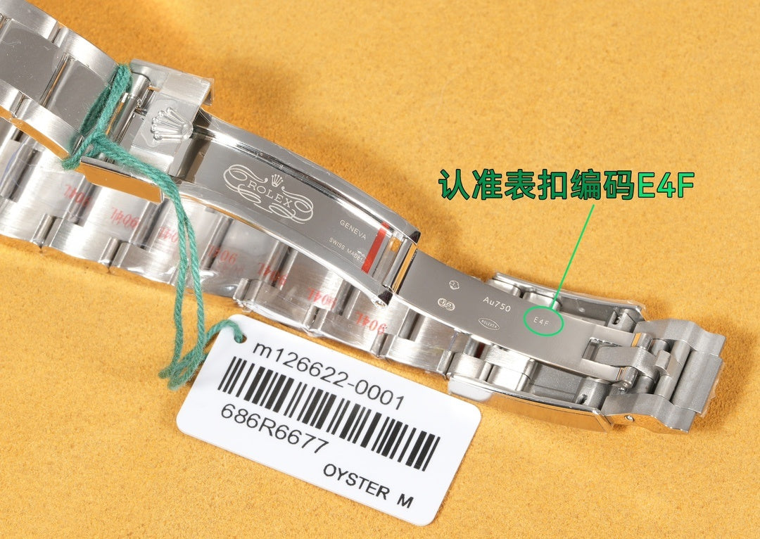 Rolex stainless steel bracelet close-up with clasp and serial label tag