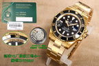Gold wristwatch with black dial and black bezel, gold bracelet shown from above