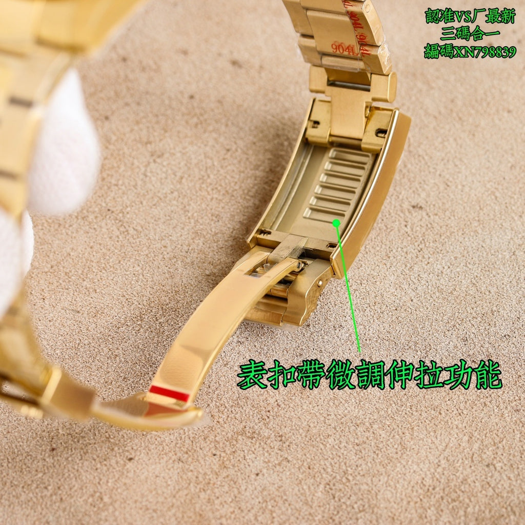 Gold watch bracelet underside with fold-over clasp and adjuster link area