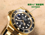Gold watch dial close-up with black face, date window, blue accent at right