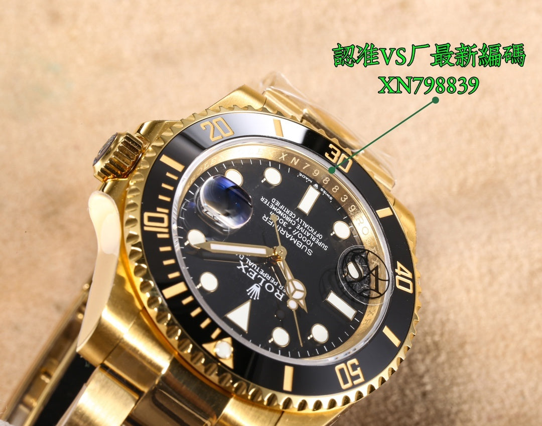 Gold watch dial close-up with black face, date window, blue accent at right