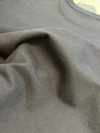 Charcoal T-shirt fabric close-up with textured weave