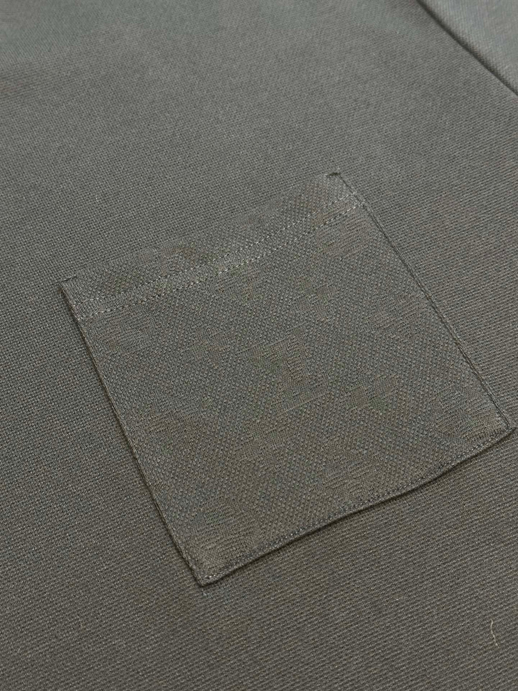Louis Vuitton dark T-shirt fabric label patch close-up