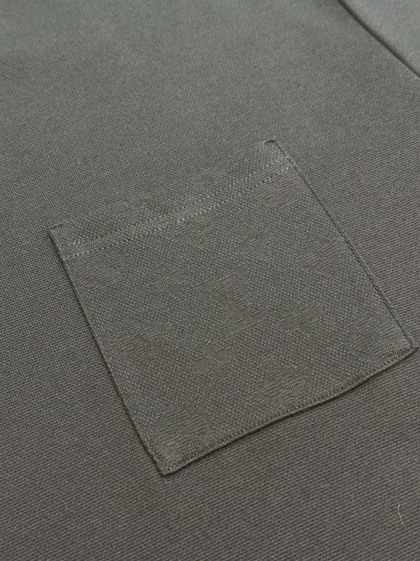 Louis Vuitton dark T-shirt fabric label patch close-up