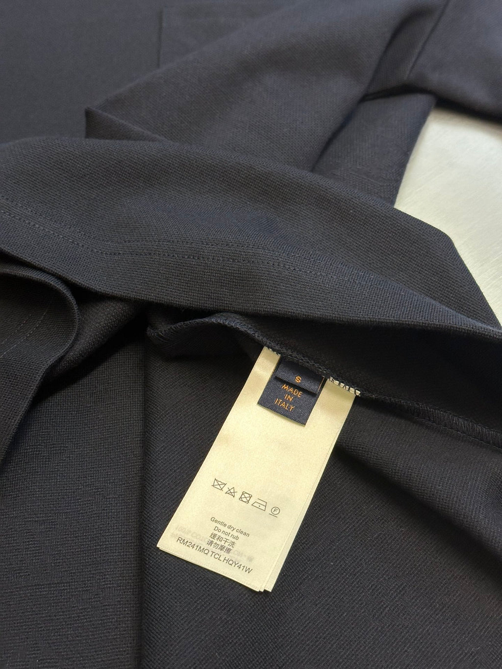 Louis Vuitton T-shirt care label inside neck with gold-toned tag