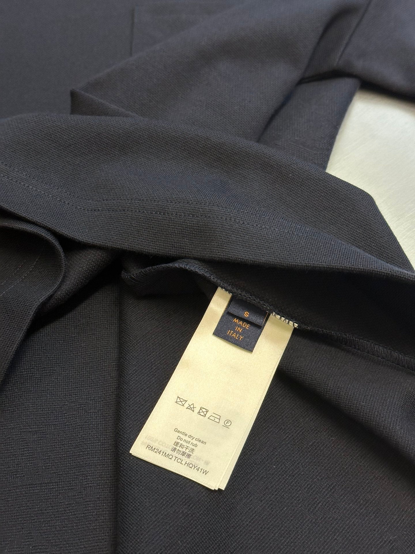 Louis Vuitton T-shirt care label inside neck with gold-toned tag