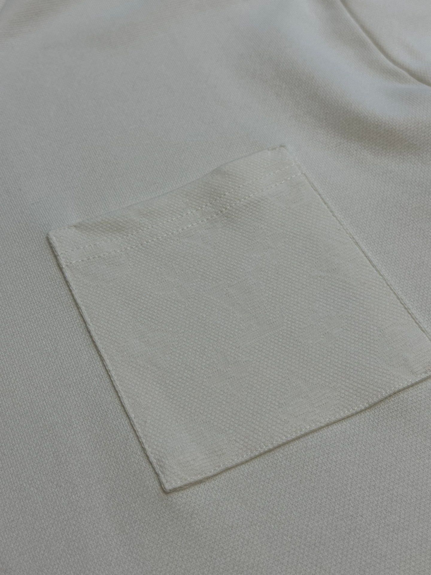 Louis Vuitton white chest pocket with stitched edge detail
