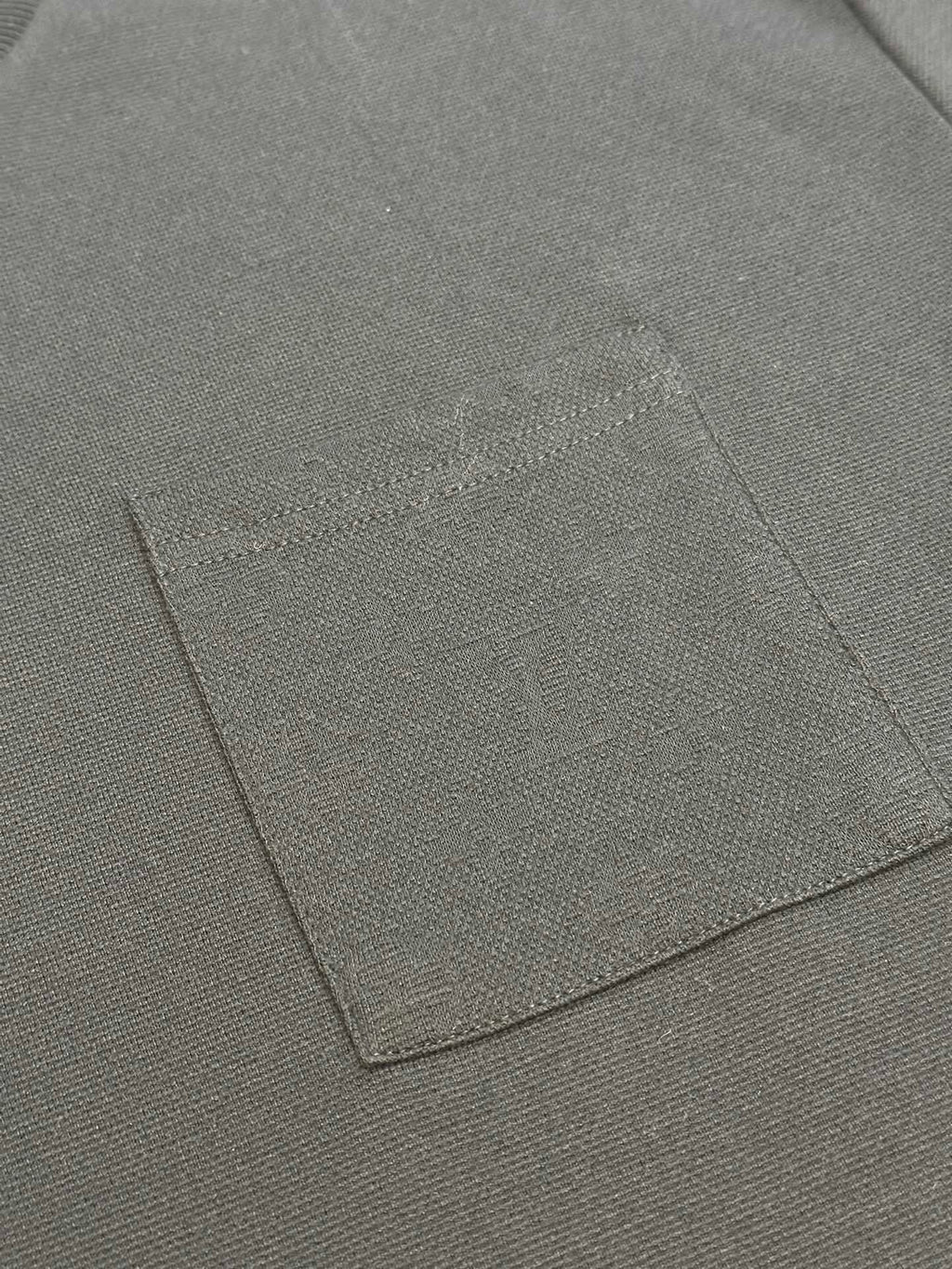 Louis Vuitton T-shirt fabric panel with visible stitching lines close-up