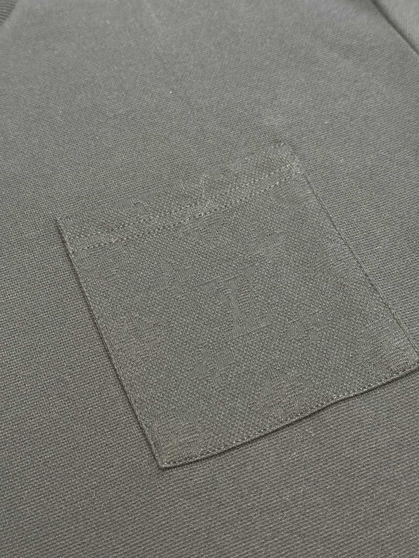Louis Vuitton T-shirt fabric panel with visible stitching lines close-up