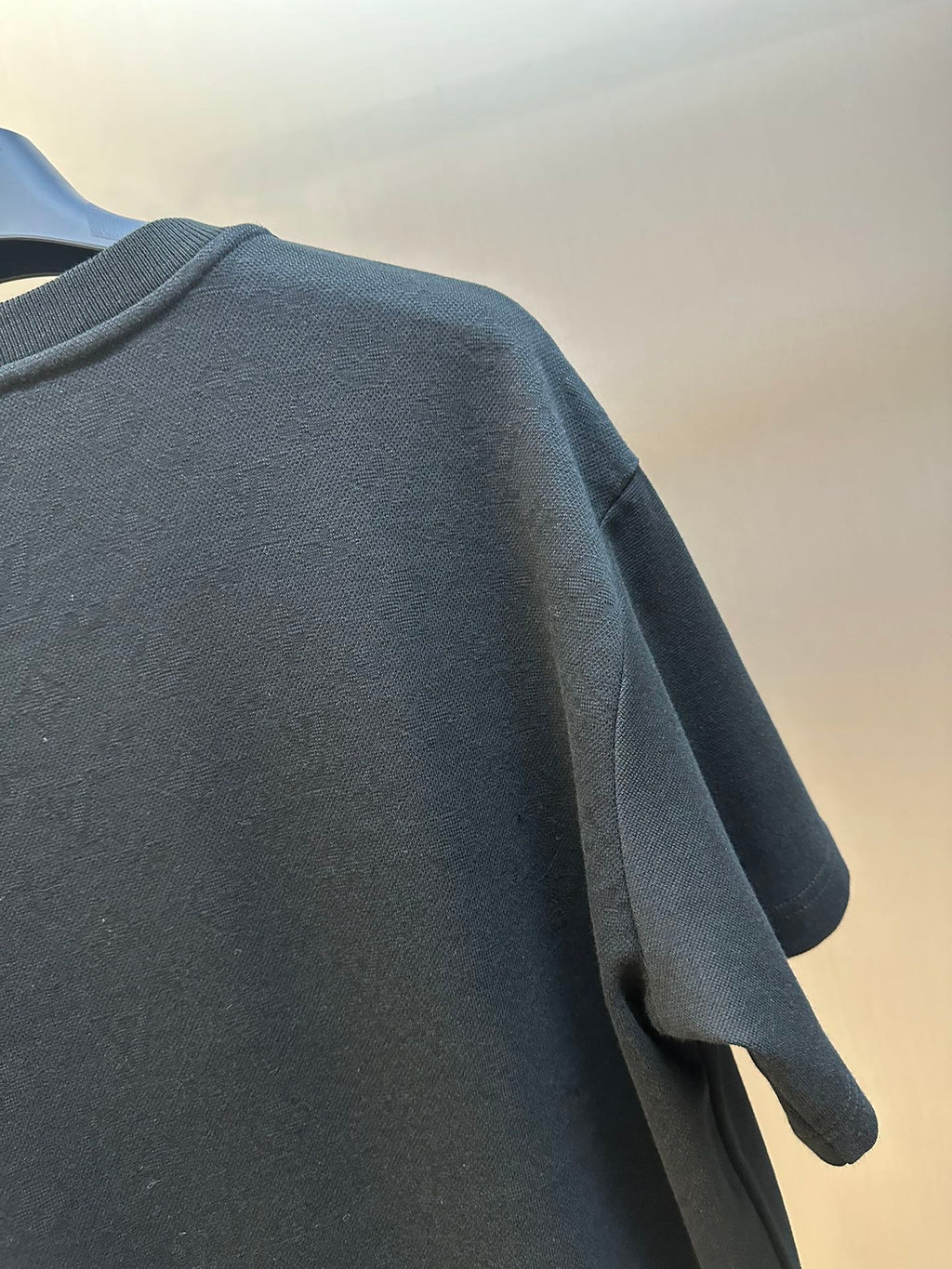 Louis Vuitton T-shirt back shoulder and sleeve seam detail, dark fabric