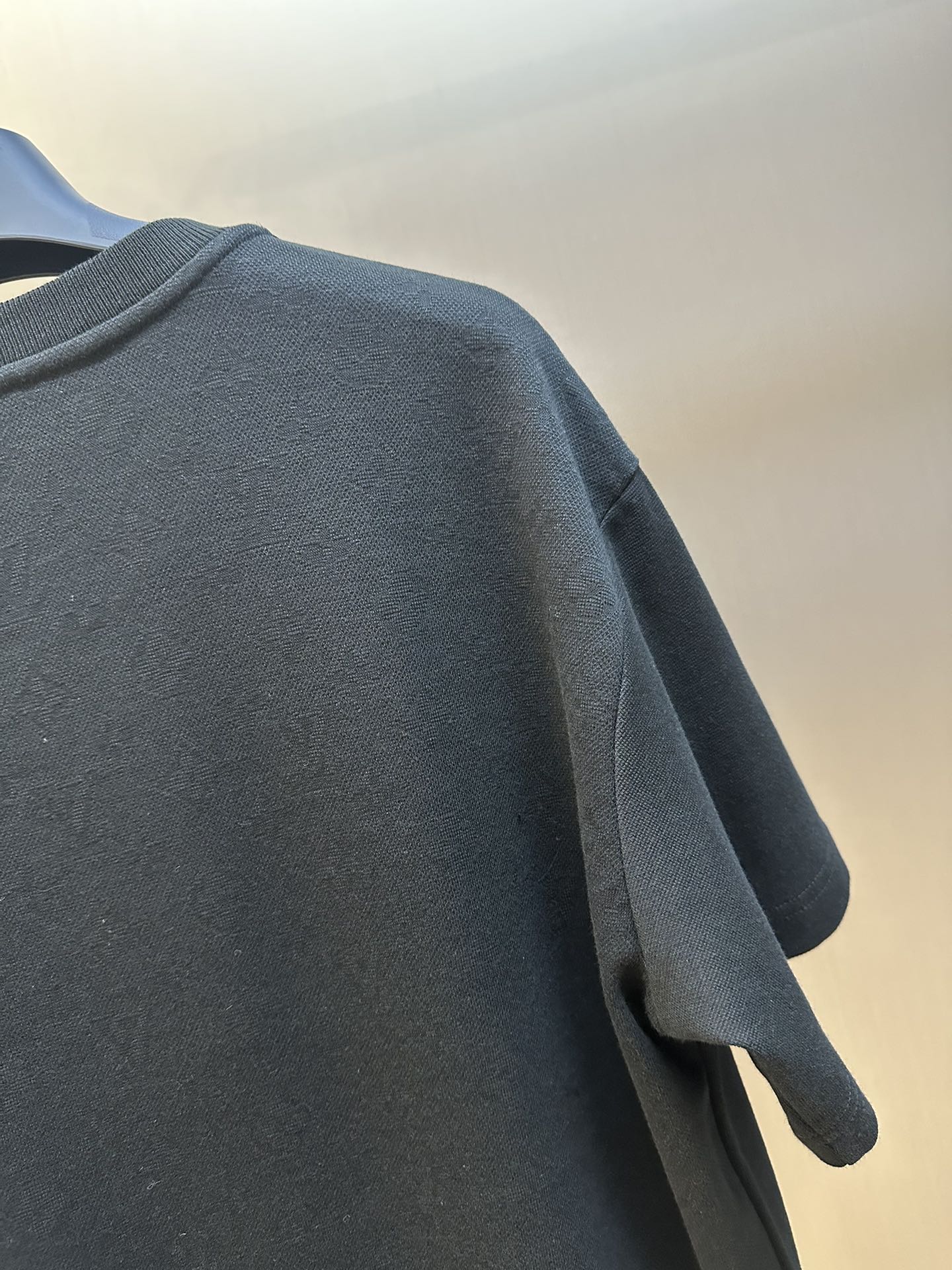 Louis Vuitton T-shirt back shoulder and sleeve seam detail, dark fabric