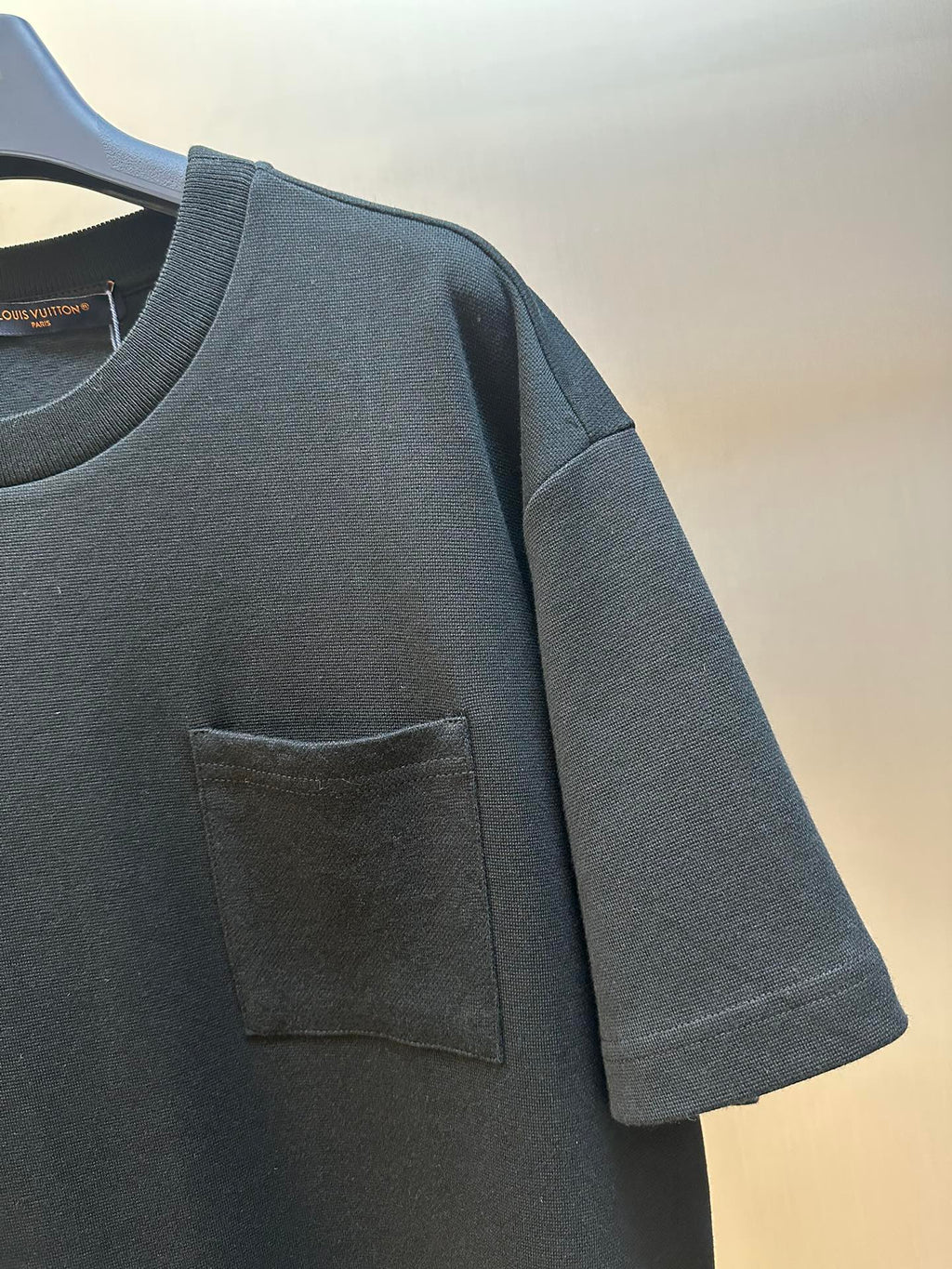Louis Vuitton short-sleeve T-shirt with chest pocket and textured fabric close-up