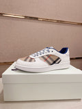 Burberry white low-top sneakers with blue lining, plaid panel, and lace-up closure