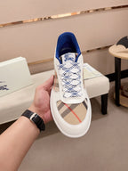 Burberry white lace-up sneaker showing blue collar lining and plaid side panel