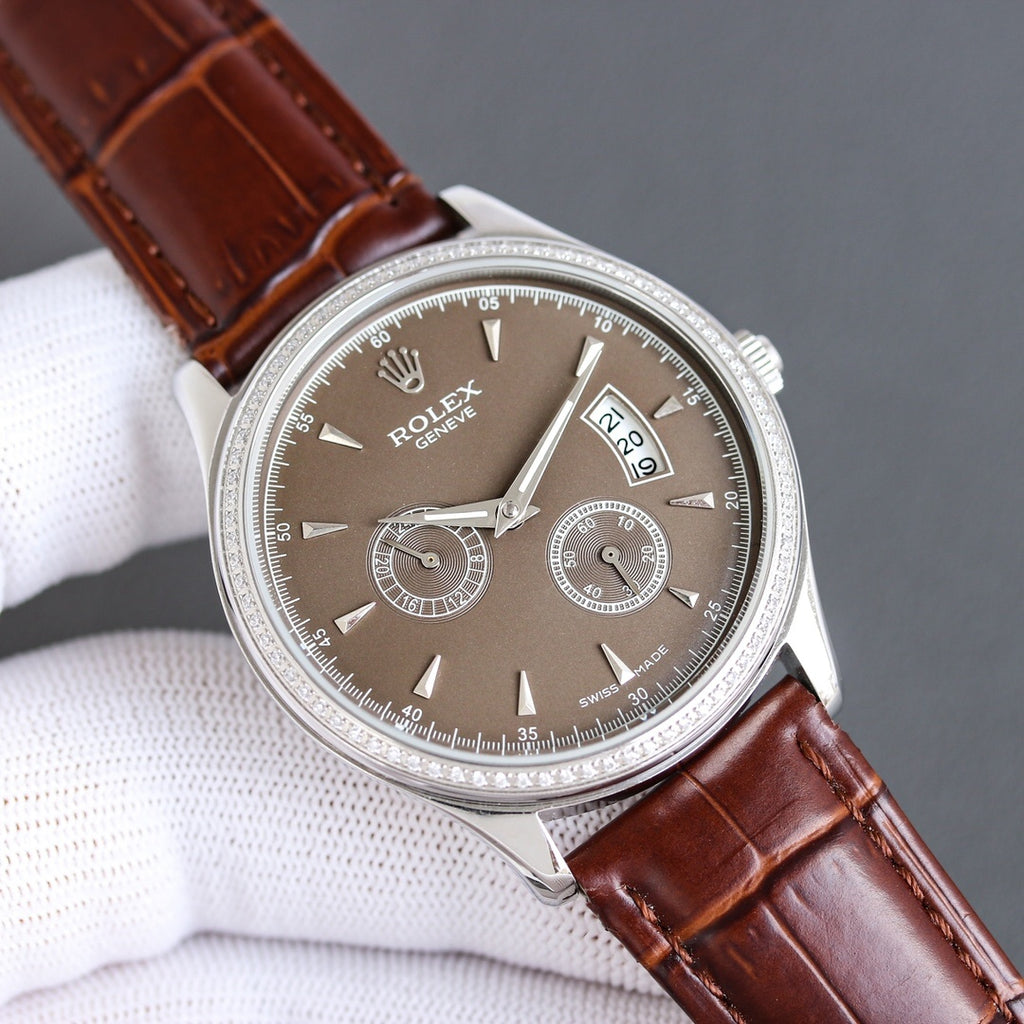 Rolex chronograph watch with dark dial, brown leather strap, silver case and subdials