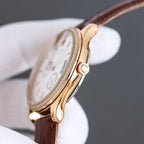 Rolex watch in rose gold tone with diamond bezel and brown leather strap