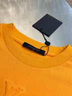 Louis Vuitton yellow T-shirt neckline with hanging brand tags and black trim