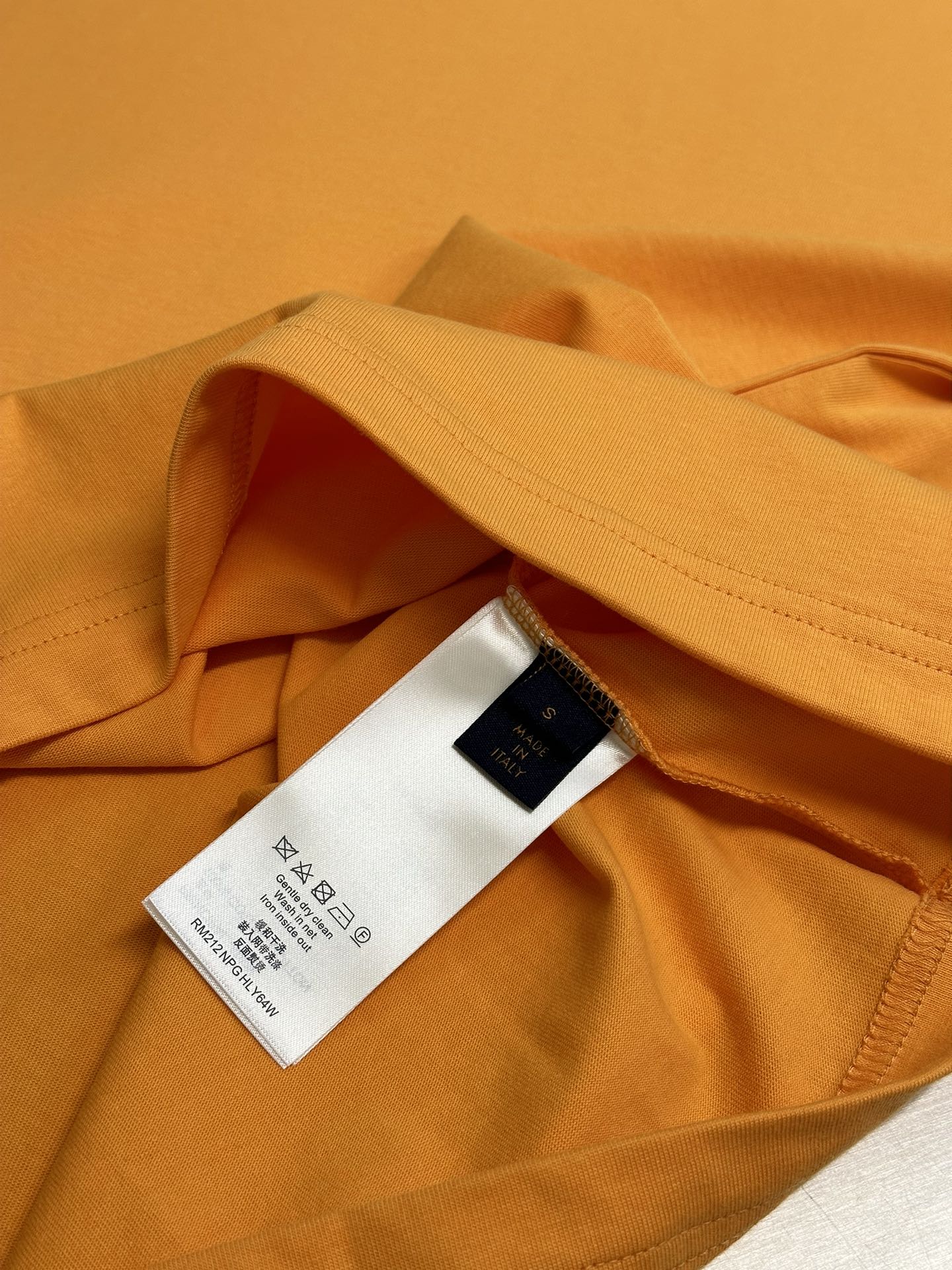 Louis Vuitton yellow T-shirt hem and inner neckline label, folded fabric detail