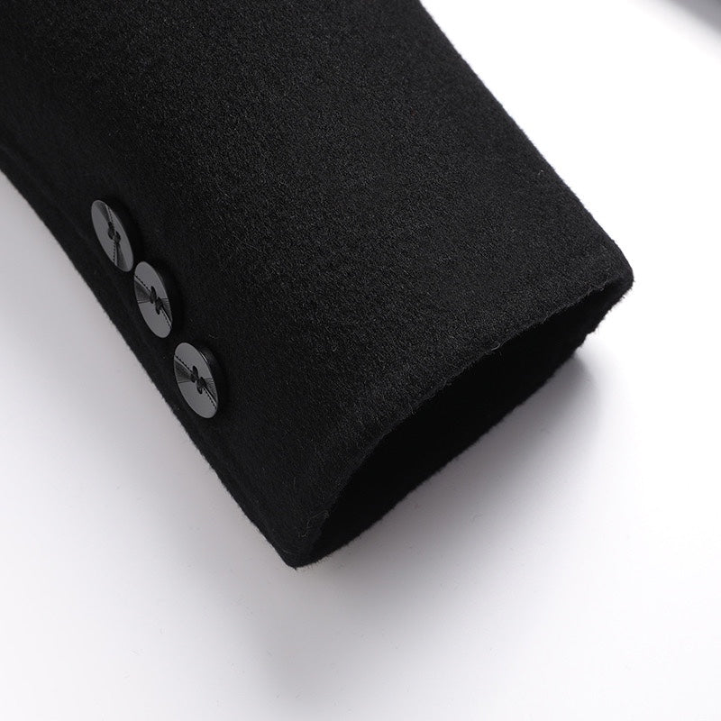 Black coat hem corner with two buttons and buttonholes