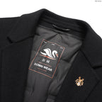 Black coat inner logo patch reading "DOWN WEAR" with decorative emblem