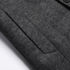 Charcoal coat sleeve with stitched seam detail and textured fabric