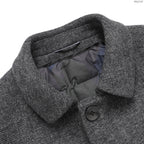 Charcoal coat collar with quilted lining and dark button closure