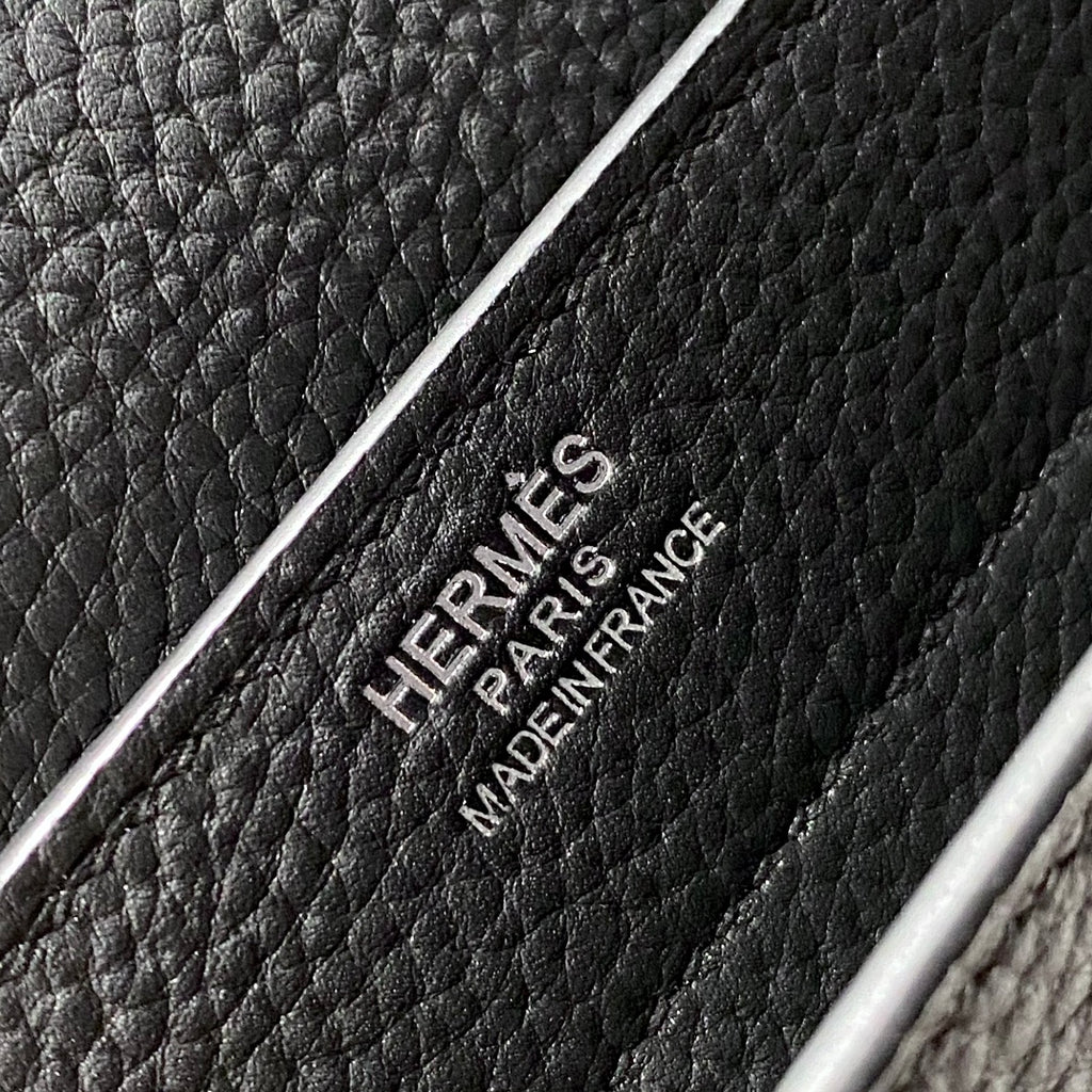 Hermes bag leather stamp reading “HERMES PARIS MADE IN FRANCE” on black grain.