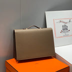 Hermes structured leather handbag with top handle and front flap