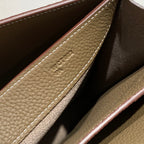 Hermes leather interior pocket with embossed logo and stitched border