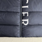 Moncler long puffer jacket front zipper seam and logo stripe, dark navy close-up