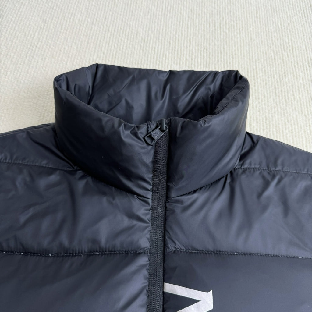 Moncler hooded puffer jacket panel, dark navy, front zipper and high collar close-up