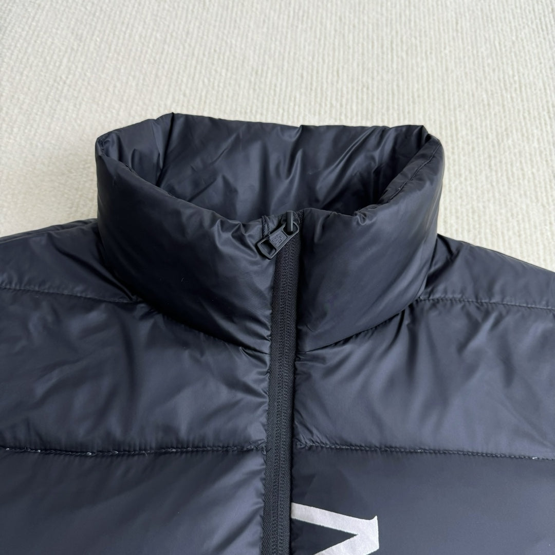Moncler hooded puffer jacket panel, dark navy, front zipper and high collar close-up