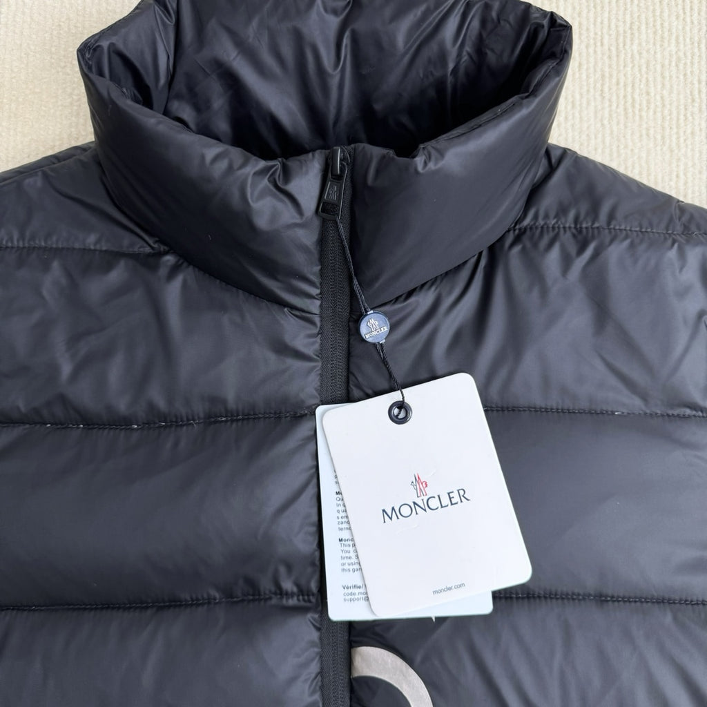 Moncler long puffer jacket in dark navy with hood, front zip, hang tag on chest