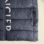 Moncler long puffer jacket bottom hem detail, dark navy quilting and zipper side