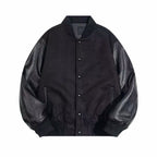 Black leather-sleeve varsity jacket with snap front and two front pockets