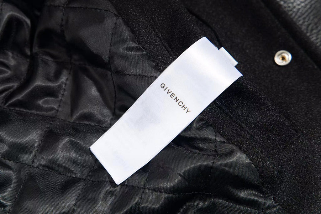 Black fabric lining with white brand tag labeled Givenchy