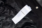 Black fabric lining with white brand tag labeled Givenchy